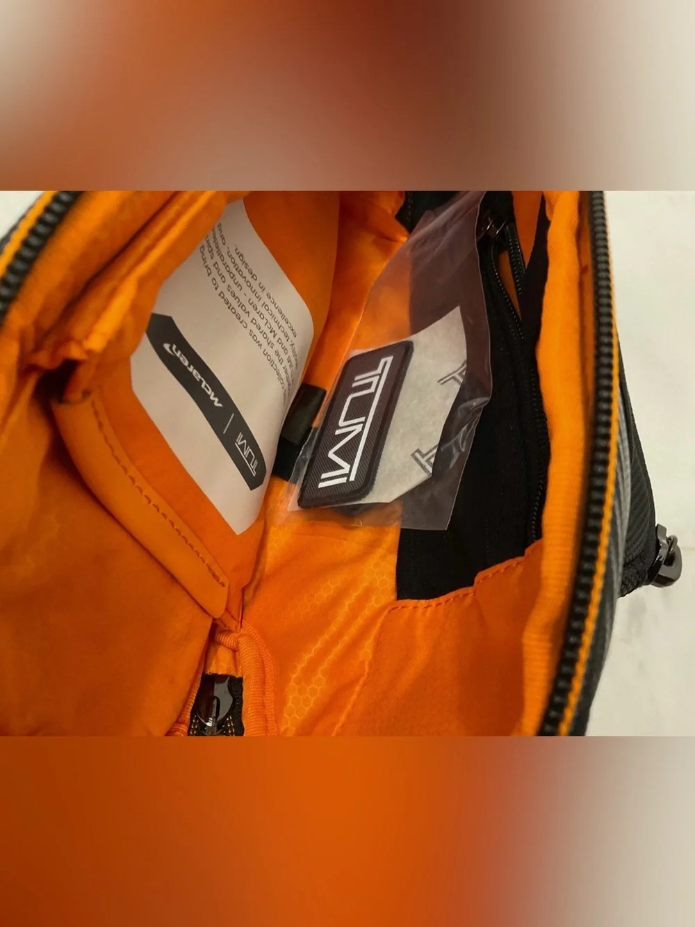 NEW Tumi McLaren Esports Downforce PRO Sling Crossbody - Black & Papaya Orange